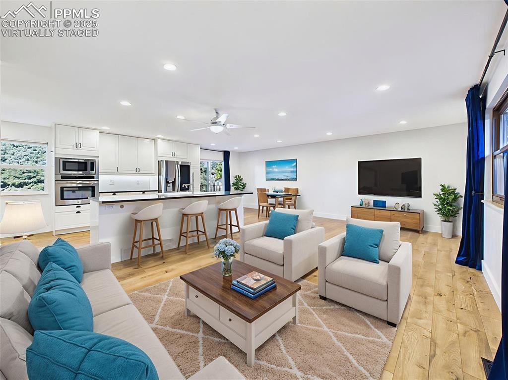 Image 4 of 50: Virtually staged to show a comfortable layout, this open space accommodates