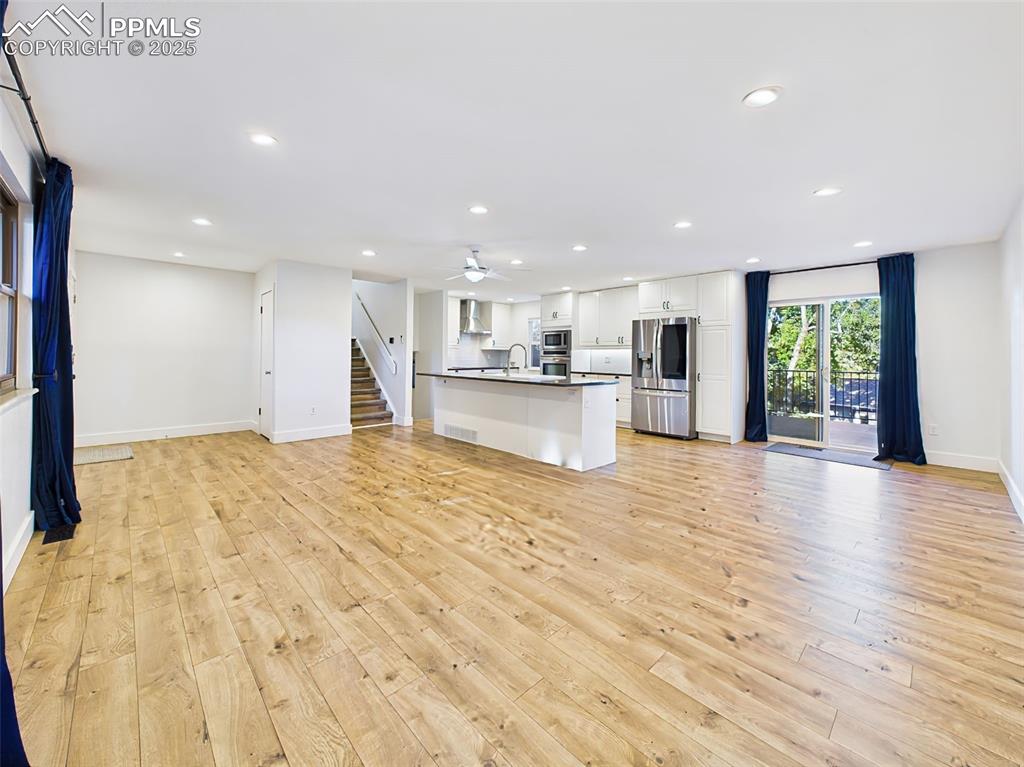Image 5 of 50: Large open-plan space with natural light, recessed lighting, and direct acc
