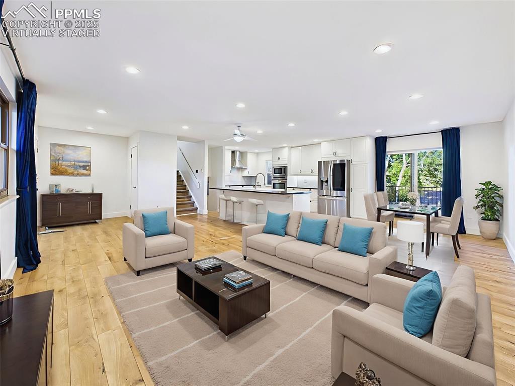 Image 6 of 50: virtually staged view highlights the generous scale of the space, easily fi