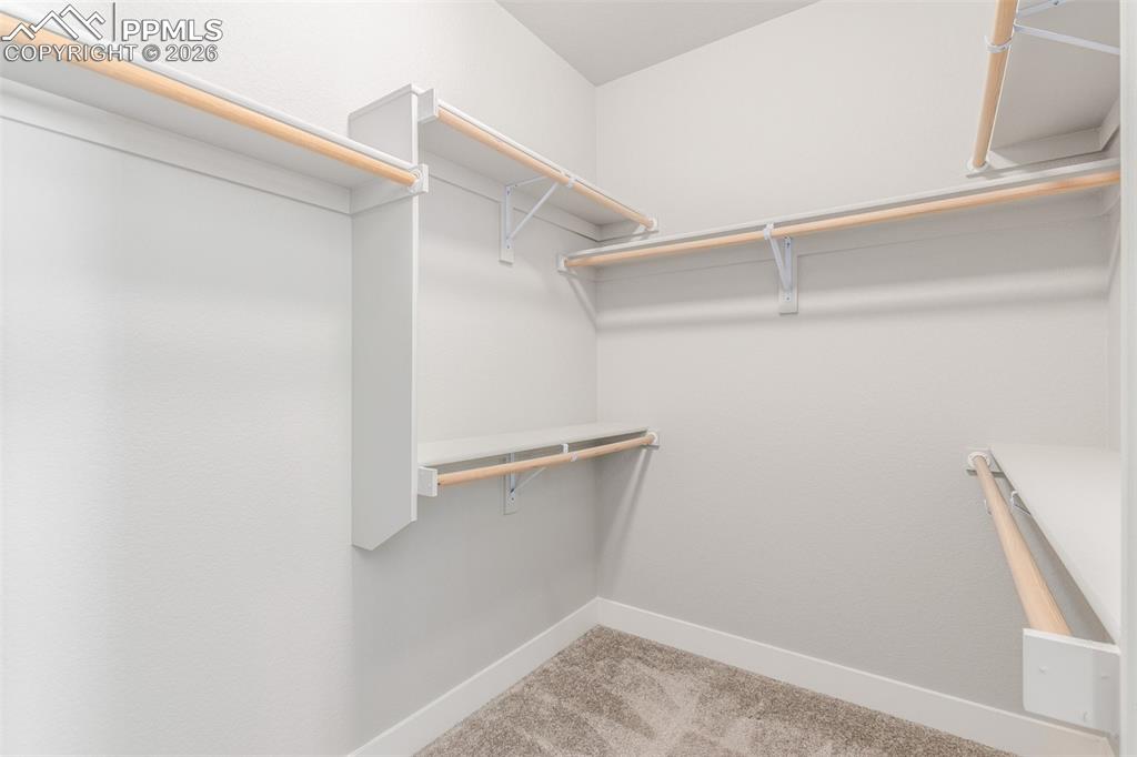 Image 20 of 46: Walk in closet 