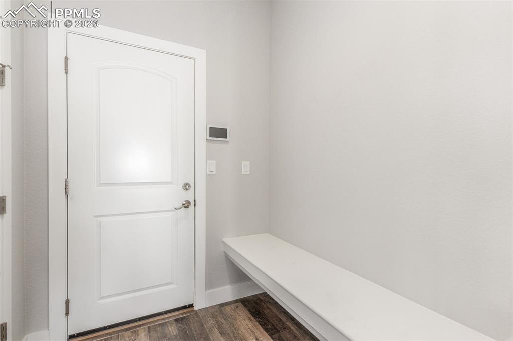 Image 32 of 46: Mudroom with dark wood-type flooring