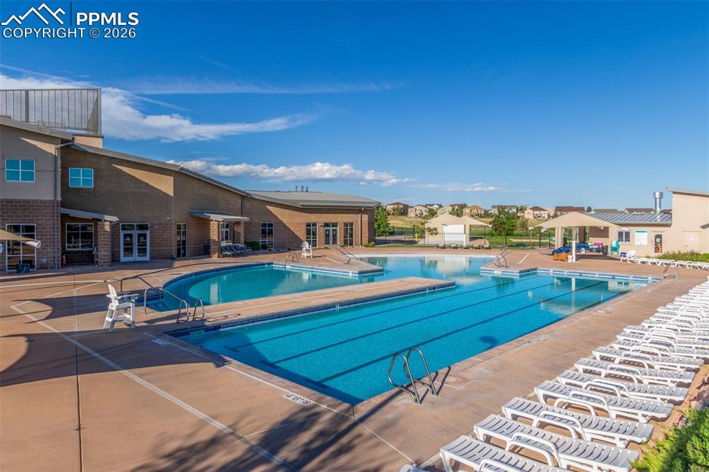 Image 37 of 46: Community pool featuring a patio area