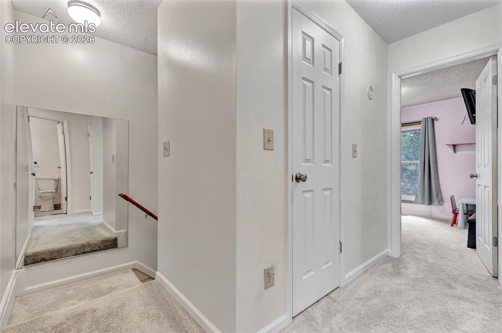 Image 31 of 44: Upstairs hall/stairs