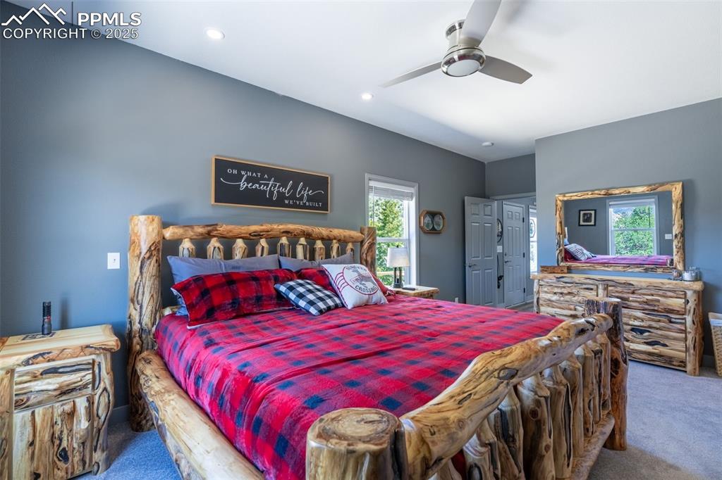 Image 11 of 41: Bedroom with carpet, ceiling fan, and recessed lighting