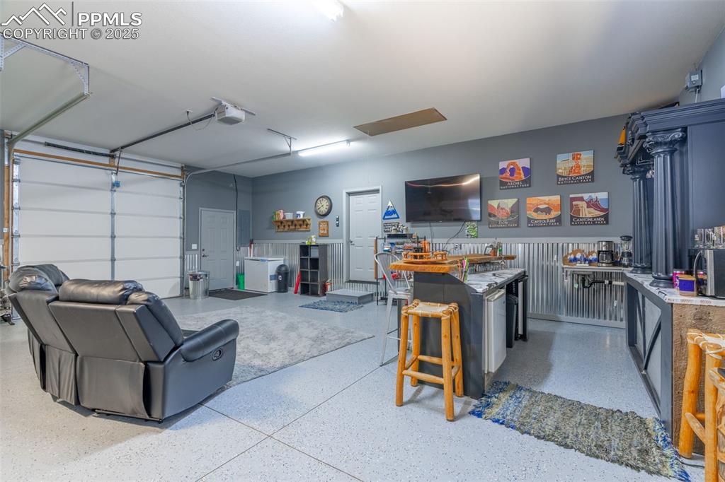 Image 26 of 41: Garage with a garage door opener