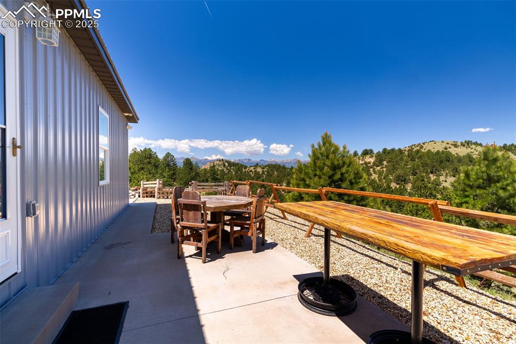 Image 31 of 41: View of patio / terrace with outdoor dining area and a mountain view