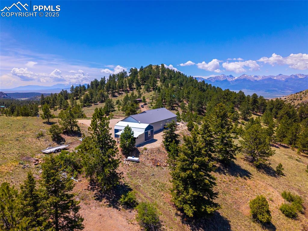 Image 35 of 41: View of subject property featuring a mountainous background