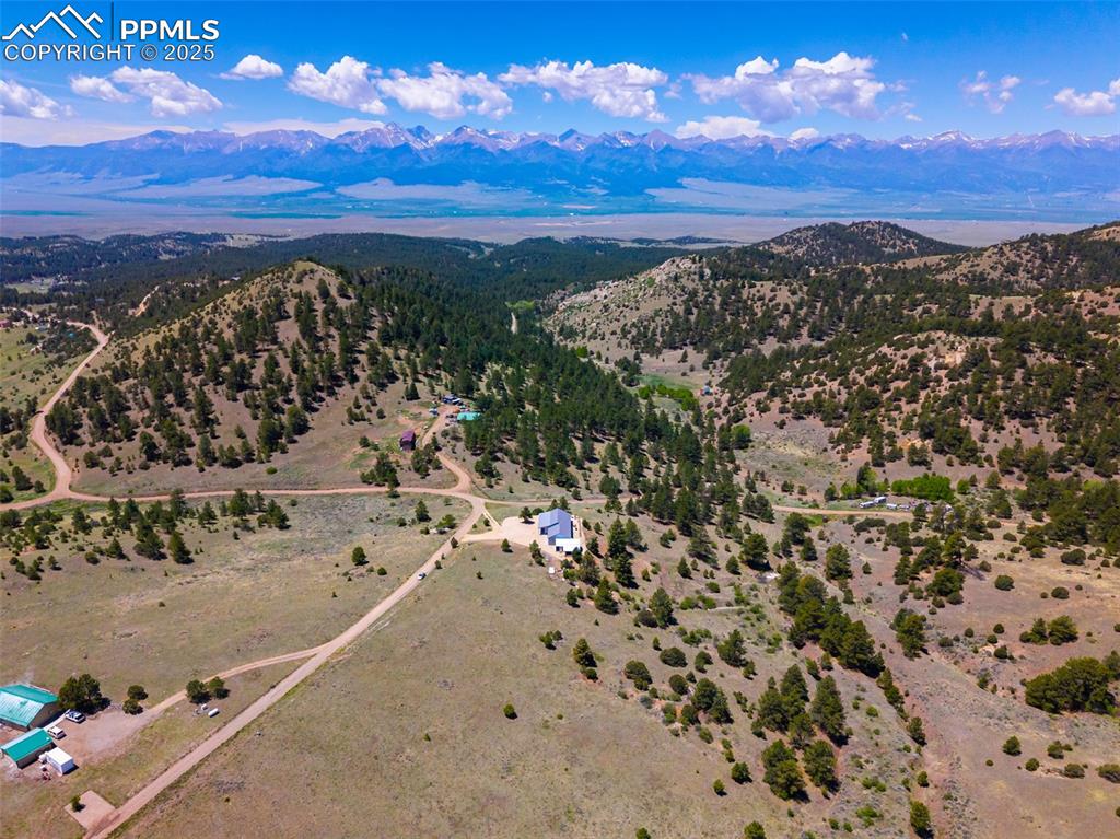 Image 36 of 41: Overview of rural landscape featuring a mountainous background