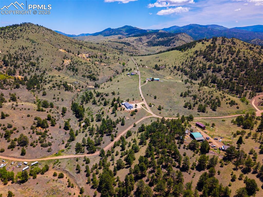 Image 37 of 41: View of rural area with a mountain backdrop