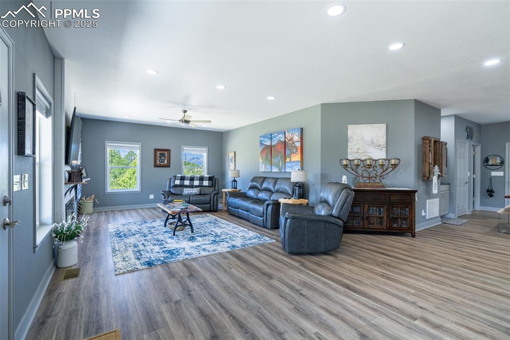 Image 4 of 41: Living area featuring recessed lighting, wood finished floors, and a ceilin
