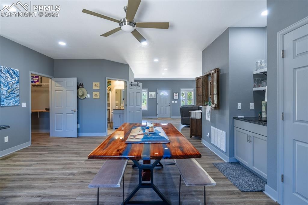Image 5 of 41: Dining area featuring wood finished floors, ceiling fan, and recessed light