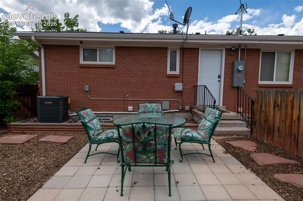 Image 34 of 40: Lower living area patio