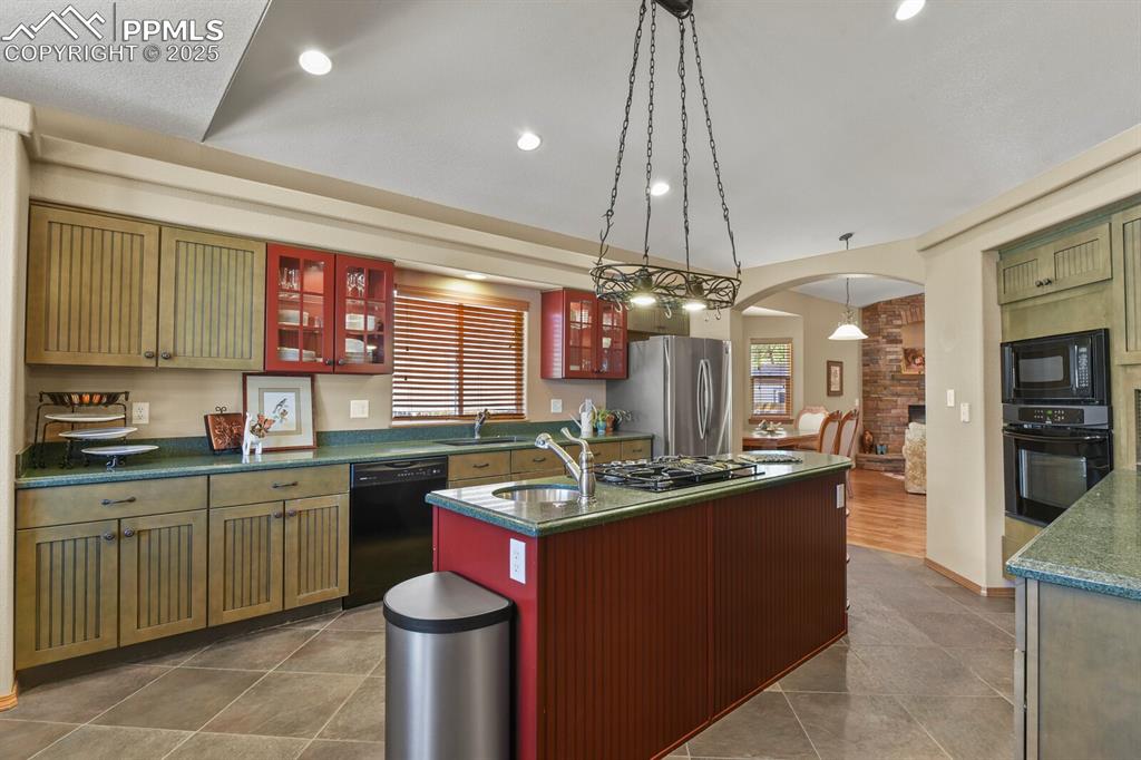 Image 10 of 49: Italian tile kitchen flooring, Silestone counter tops