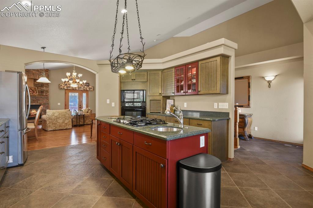 Image 11 of 49: Gourmet kitchen with vegetable sink, appliance garage