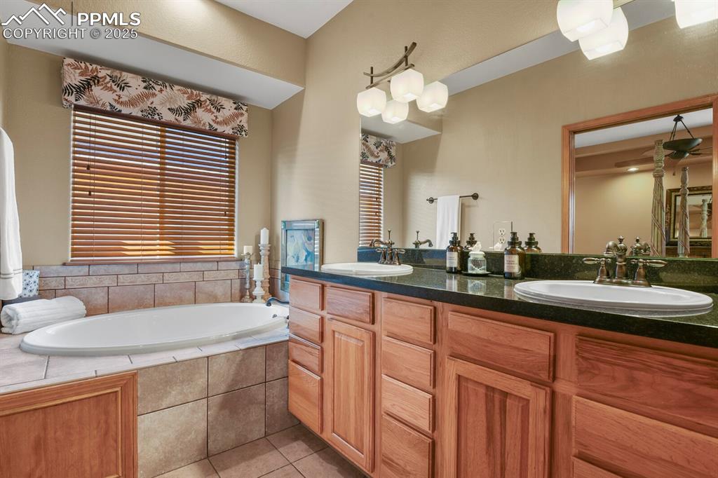 Image 18 of 49: Adjoining 5 piece primary bath