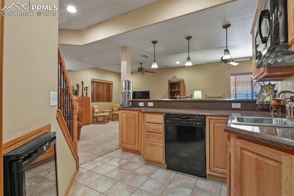 Image 27 of 49: with dishwasher, sink, beverage center, & microwave