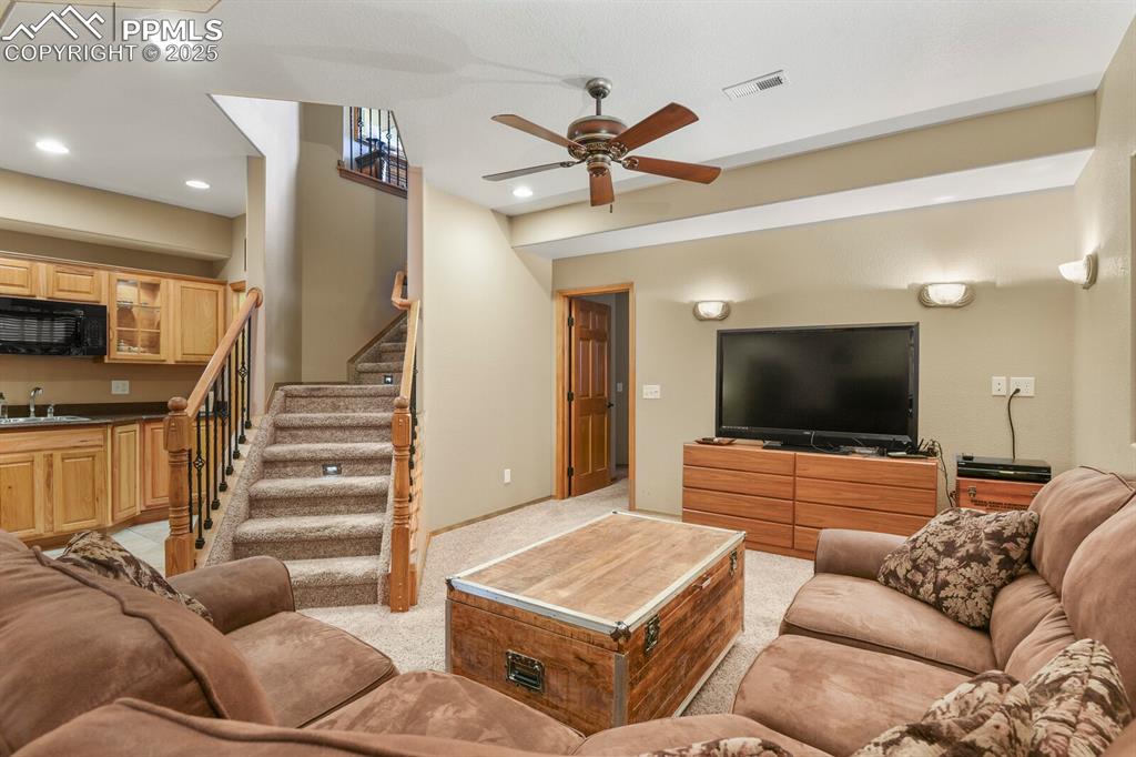 Image 28 of 49: Spacious lower level family room 