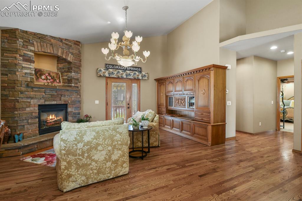 Image 5 of 49: Stone gas fireplace & Walk out to the back yard