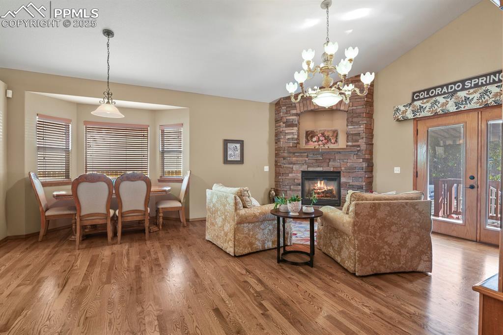 Image 6 of 49: Connects with dining area, hardwood flooring