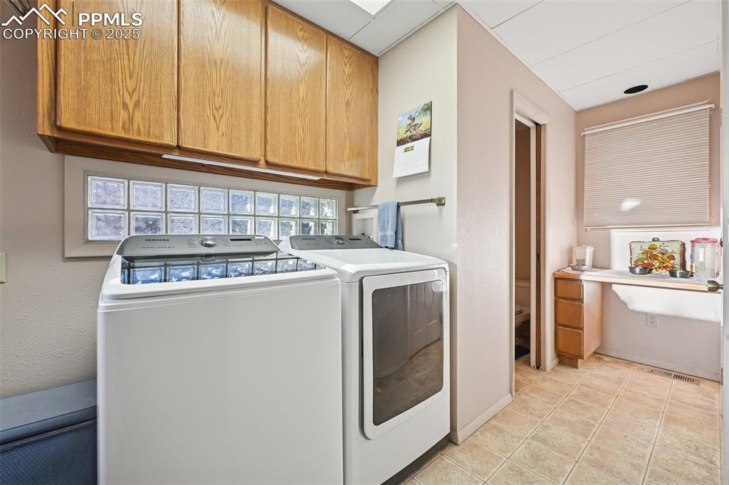 Image 36 of 48: Half bath and door to deck off laundry room