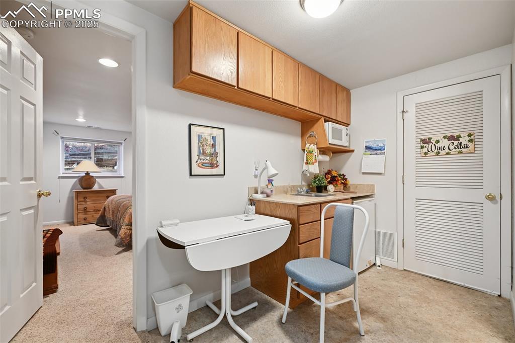 Image 39 of 48: Home office featuring light colored carpet and recessed lighting