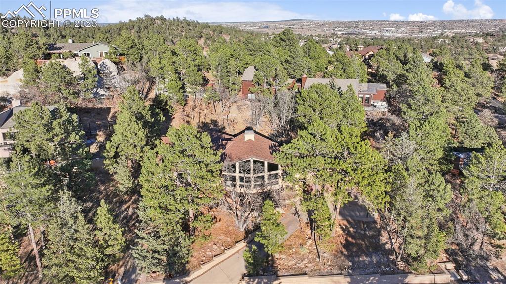 Image 8 of 48: View of property location with a forest