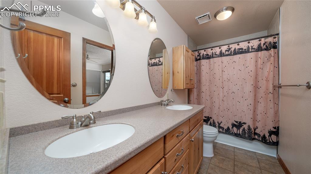 Image 12 of 36: Upper full bath