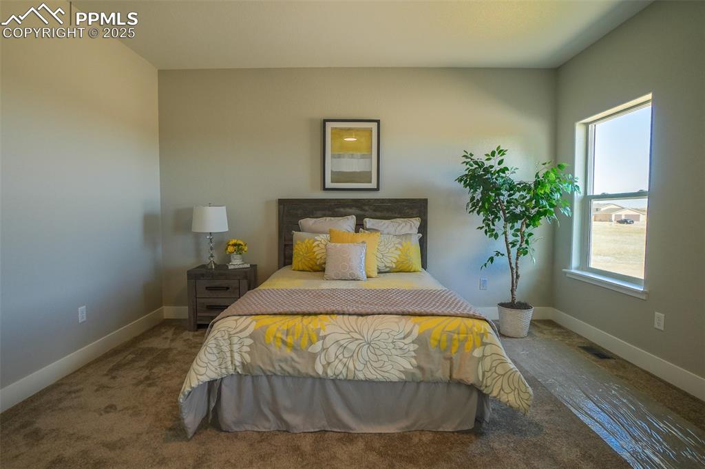 Image 23 of 47: Bedroom featuring carpet flooring