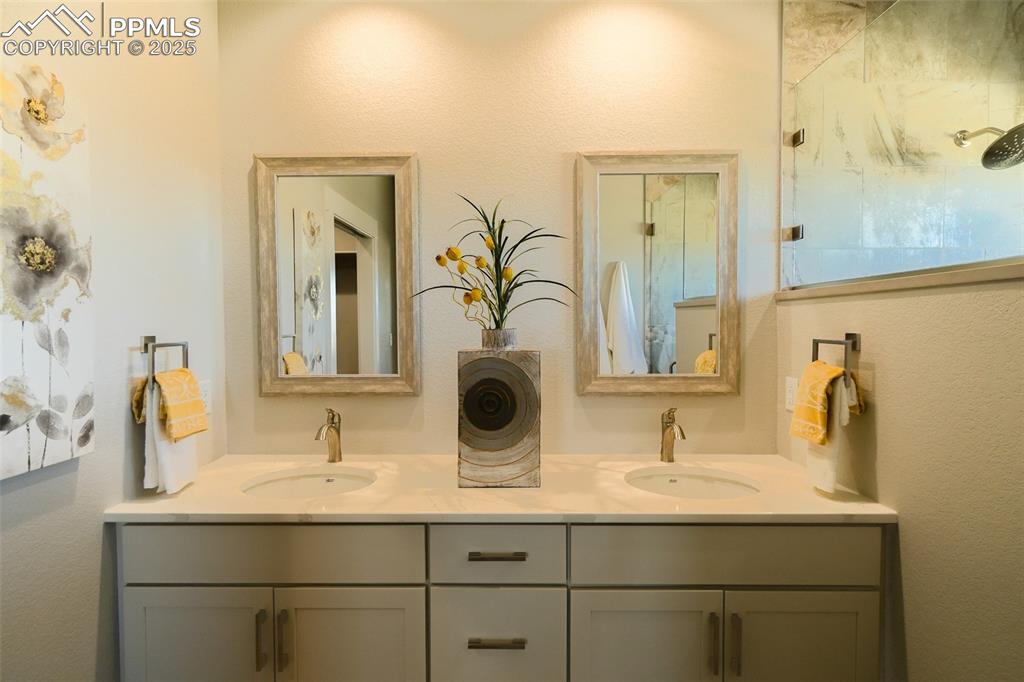 Image 25 of 47: Bathroom with dual vanity