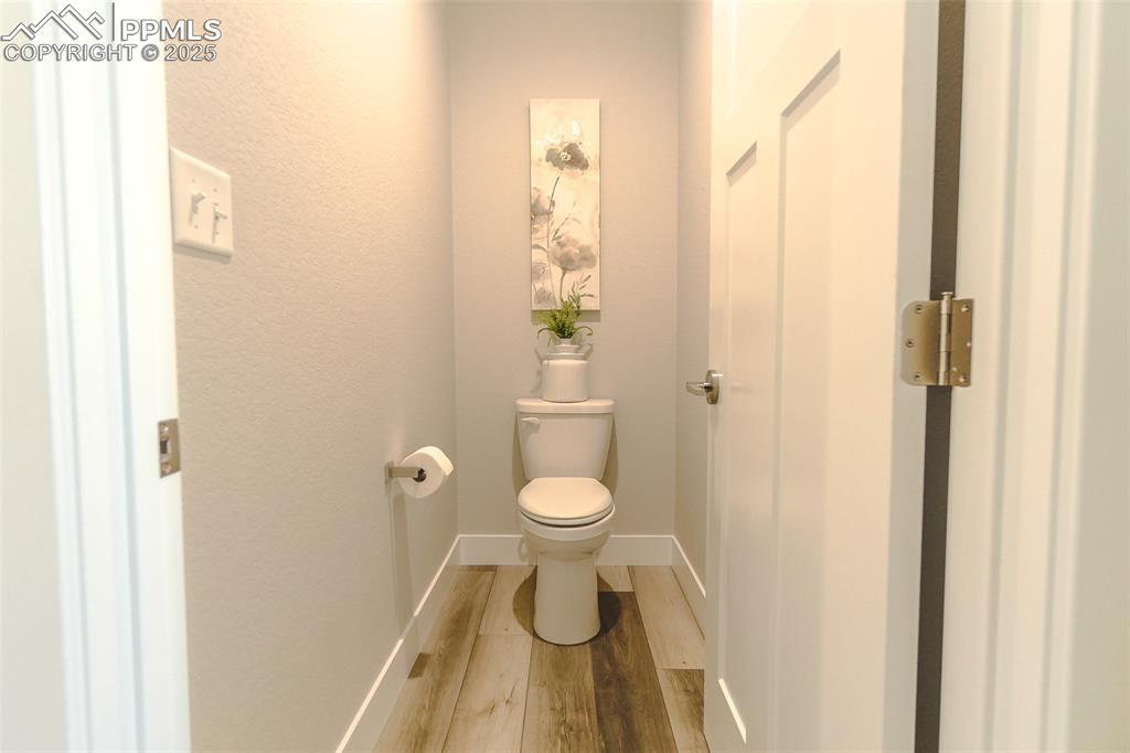 Image 27 of 47: Bathroom with wood-type flooring and toilet