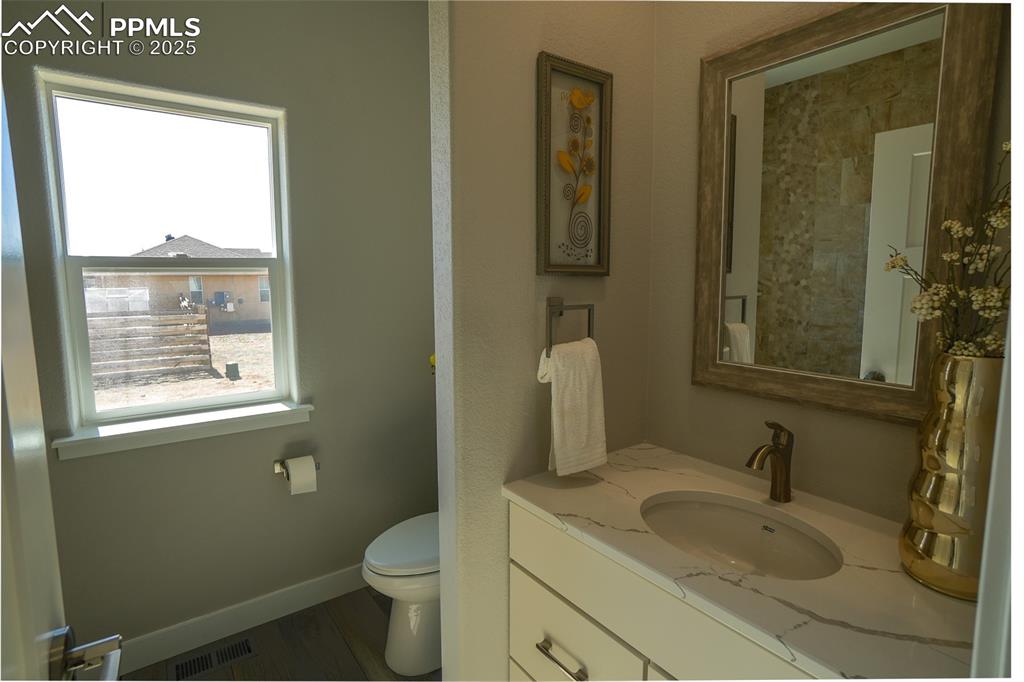 Image 29 of 47: Bathroom featuring vanity and toilet