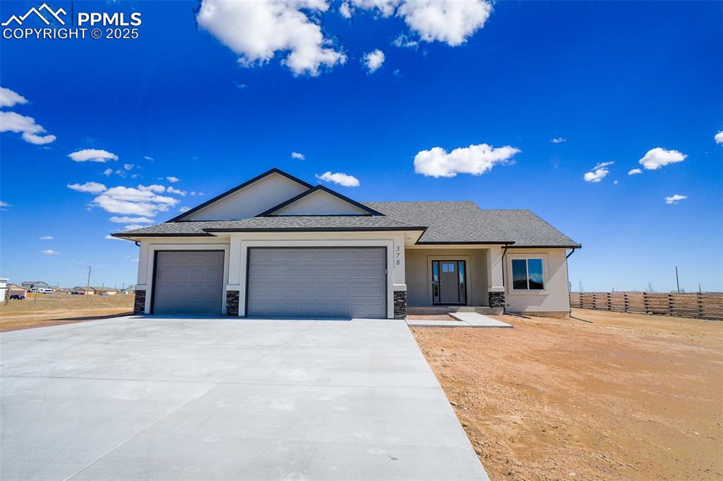 Image 3 of 47: View of front facade featuring a garage