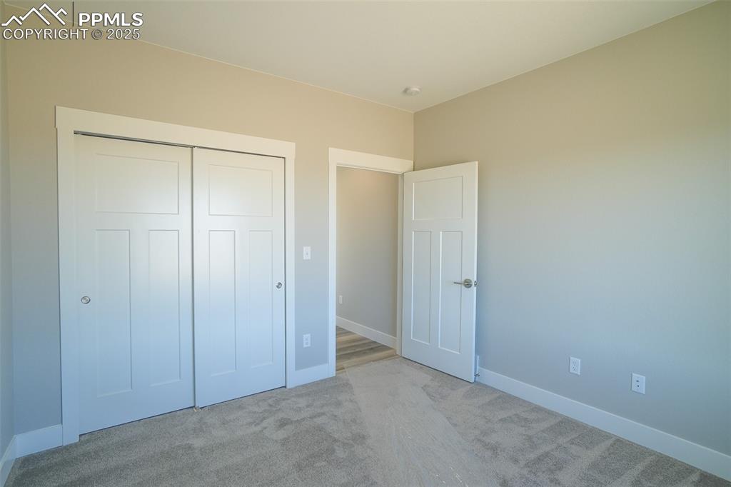 Image 30 of 47: Unfurnished #2 bedroom with light carpet and a closet