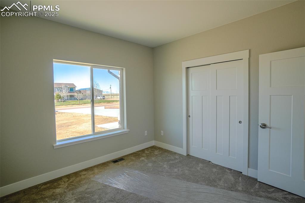 Image 31 of 47: Unfurnished #2 bedroom featuring a closet and carpet floors