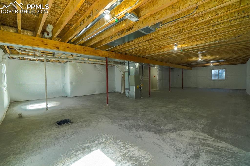 Image 38 of 47: Basement featuring heating unit