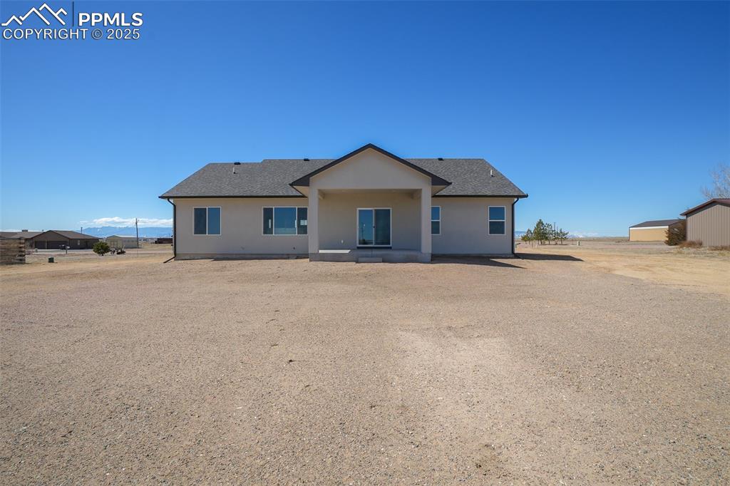 Image 40 of 47: View of front of property with an outdoor structure
