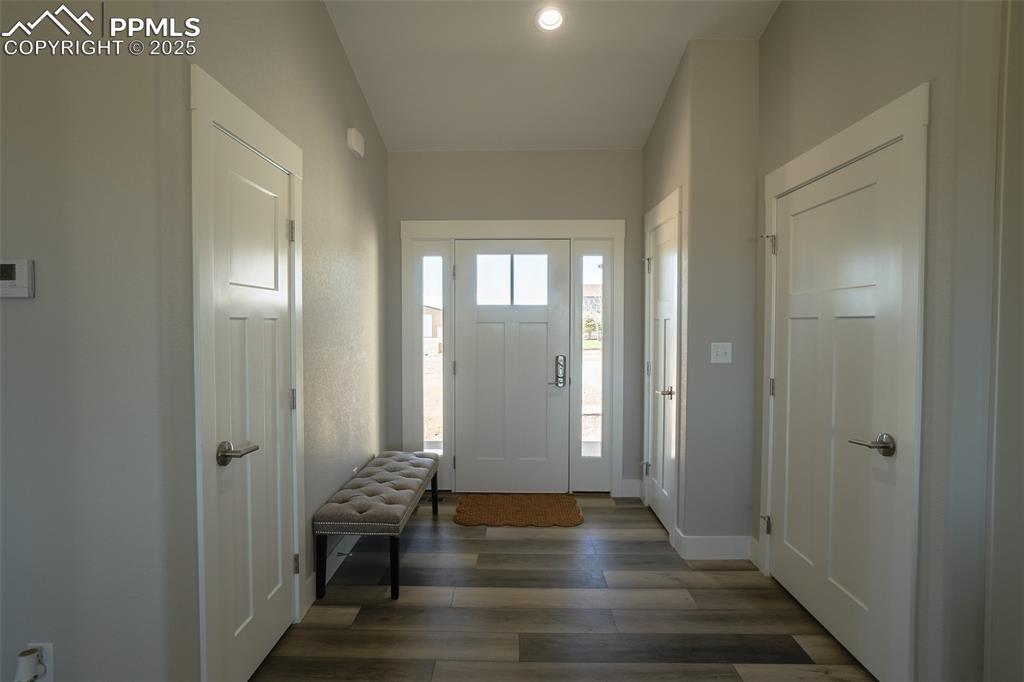 Image 8 of 47: Foyer featuring dark -LTV flooring
