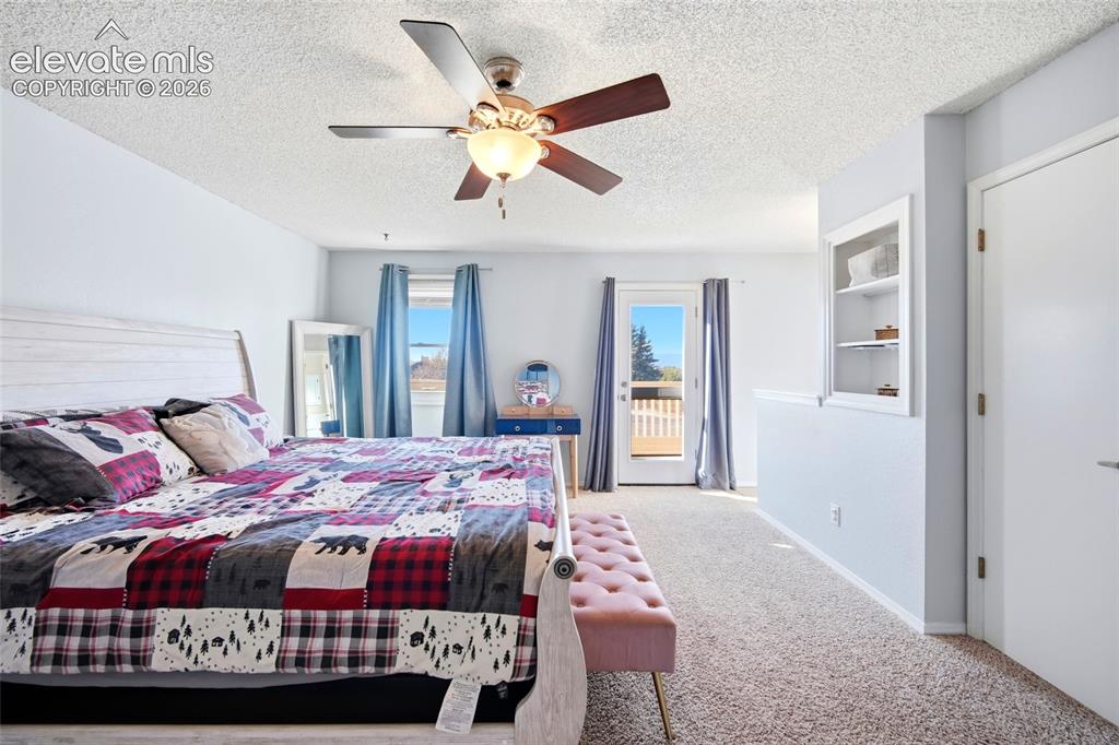 Image 23 of 50: LARGE PRIMARY BEDROOM AND WALK OUT TO THE PRIVATE BALCONY.