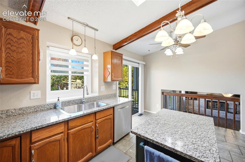 Image 9 of 50: KITCHEN ADJOINS THE FAMILY ROOM.