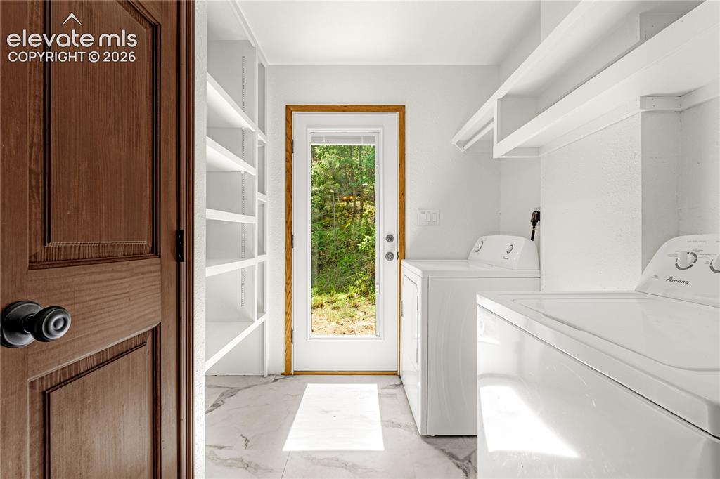 Image 11 of 44: Laundry/mudroom off the kitchen 