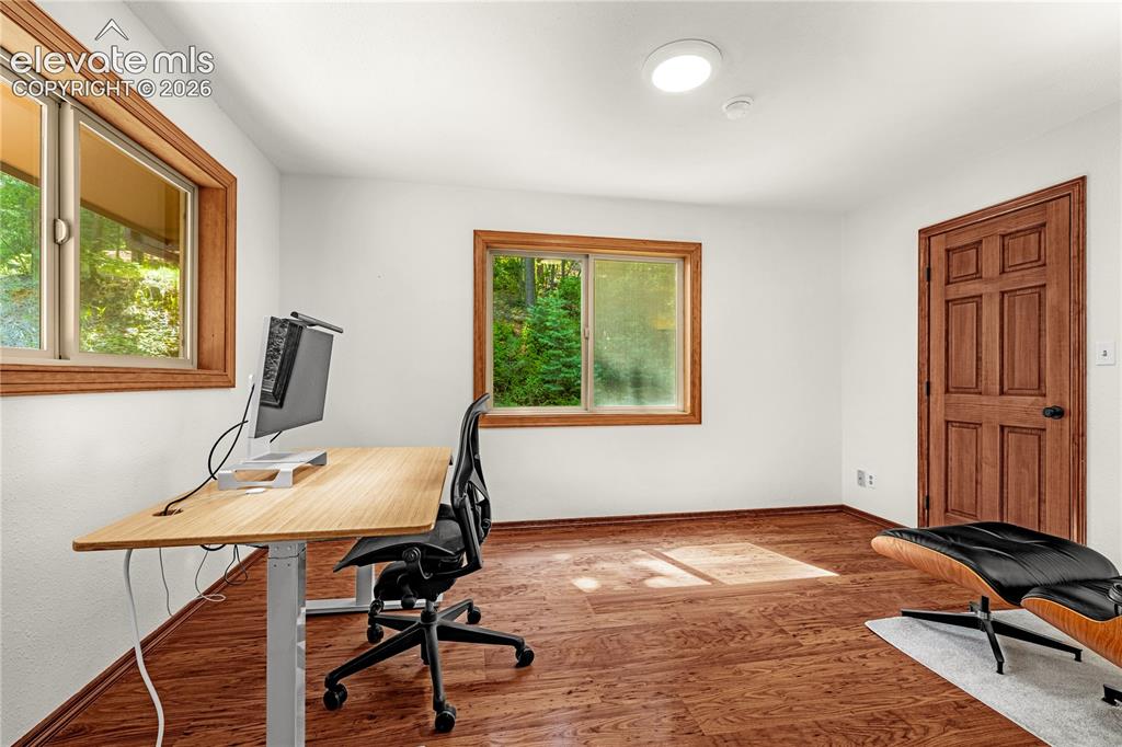 Image 12 of 44: Main level Bedroom currently being used as an office