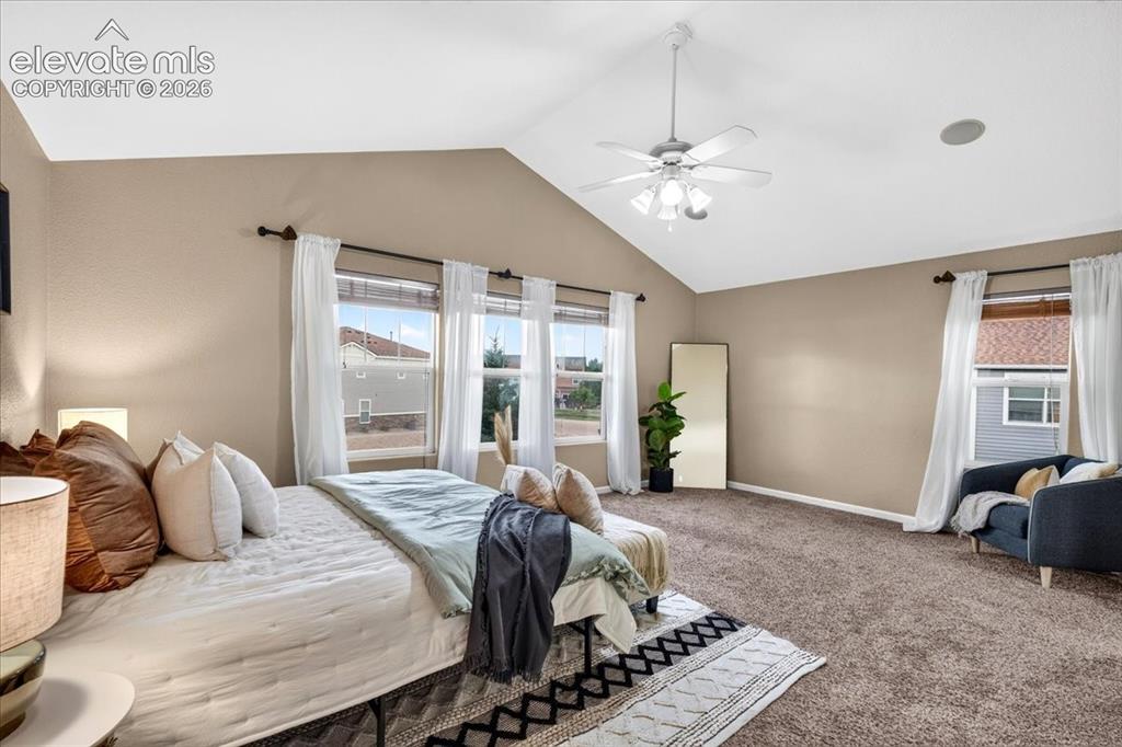 Image 13 of 28: Vaulted ceiling with an attached ceiling fan, recessed ceiling speaker, car
