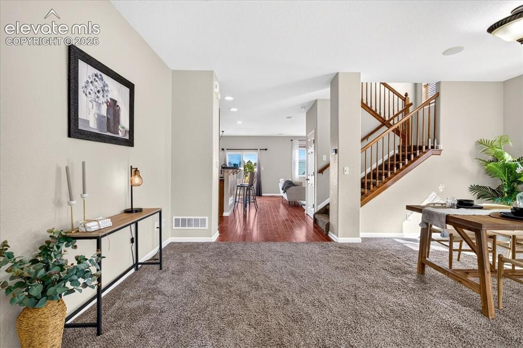 Image 6 of 28: Neutral-toned walls complement the carpeted and wood-finish flooring