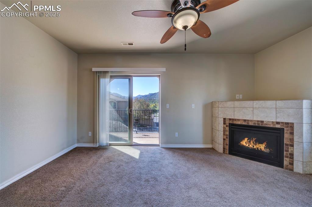 Image 4 of 36: Living room with walkout to the balcony
