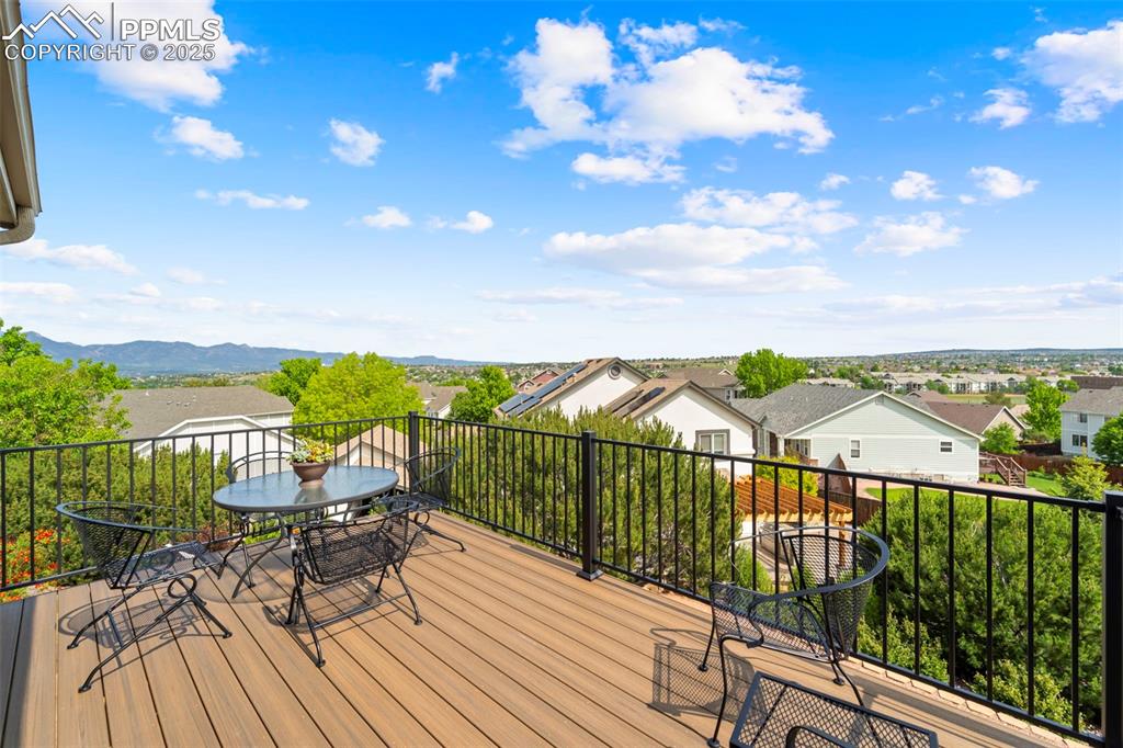 Image 17 of 41: Brand new deck off family room with mountain and city views