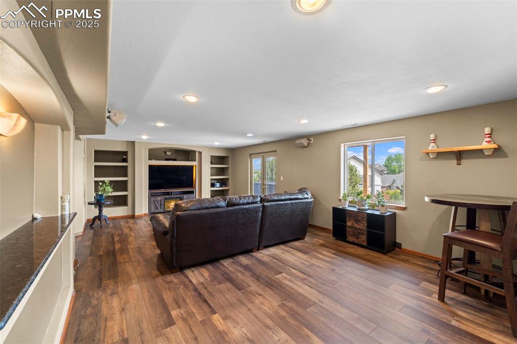 Image 31 of 41: Open concept basement kitchen and family room
