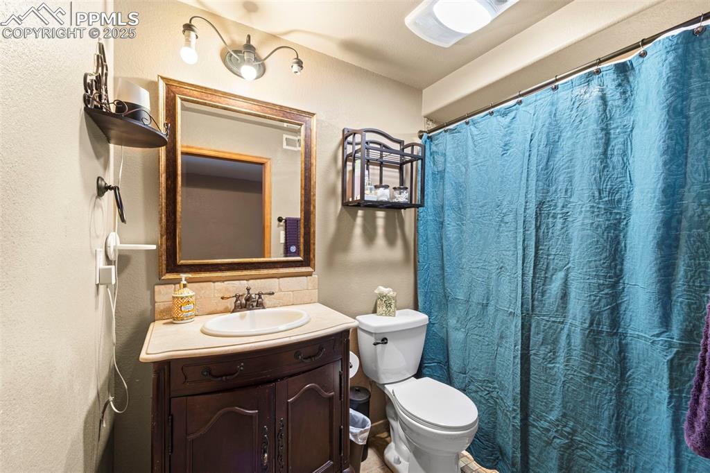 Image 32 of 41: Basement 3/4 bath with roll in shower