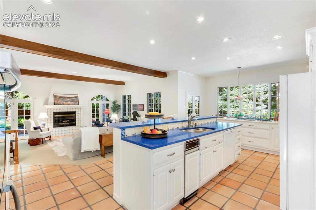 Image 15 of 50: Kitchen open to stepdown family room