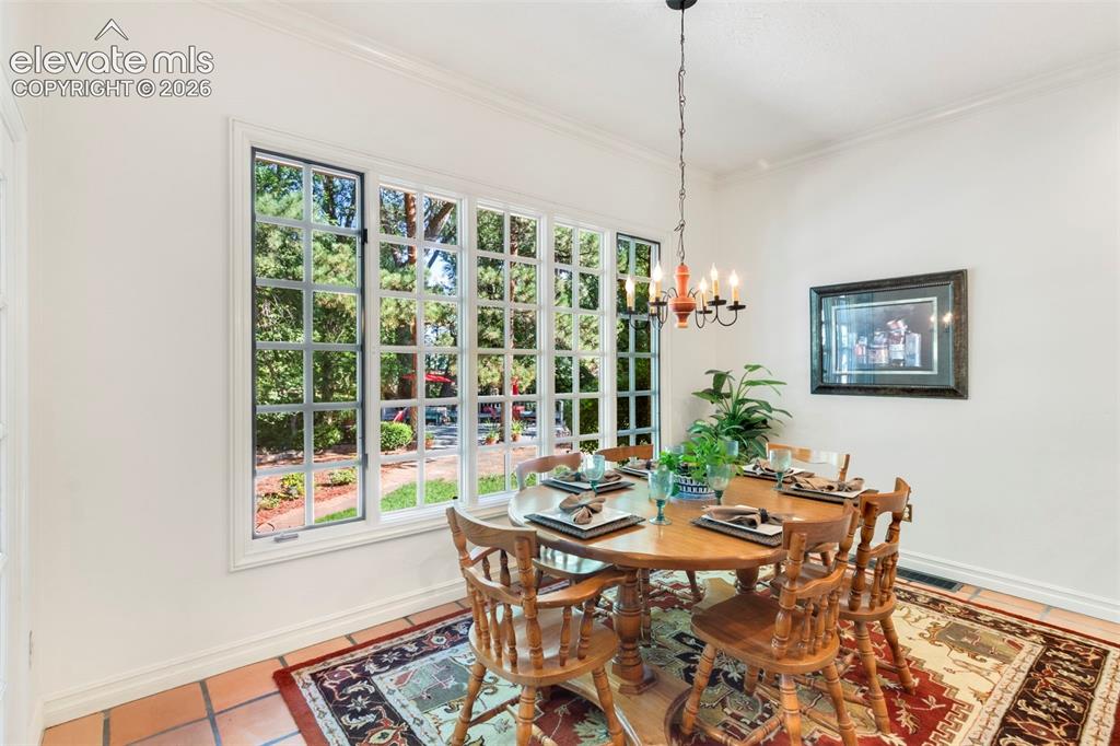 Image 17 of 50: Kitchen Casual dining area with walkout