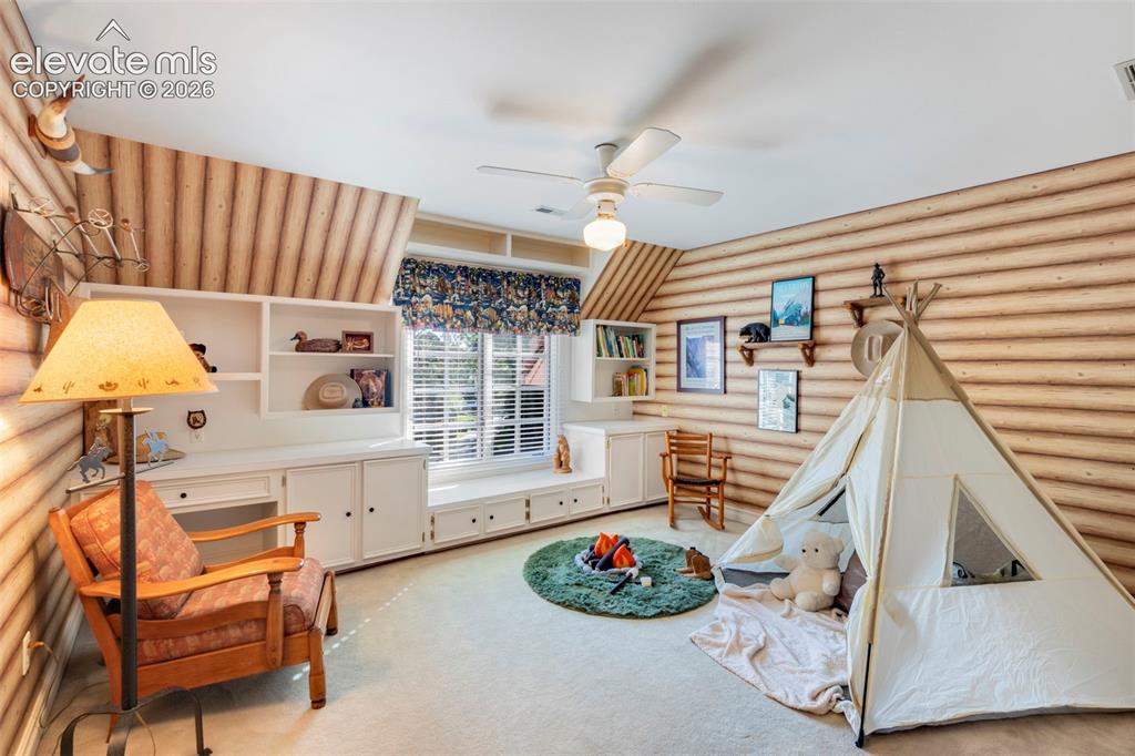 Image 28 of 50: Upstairs bedroom with built-ins - Jack N Jill bath